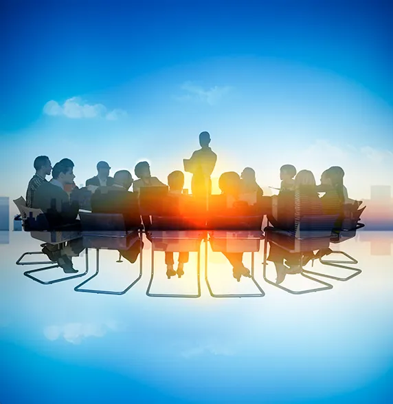 A leader standing before a team during a strategic meeting, symbolizing inspiration, vision, and collaborative leadership