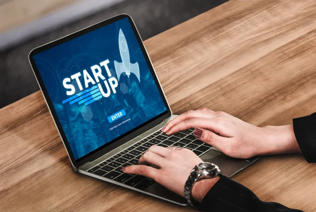 Entrepreneur launching a startup project on a laptop, representing the beginning of a business journey